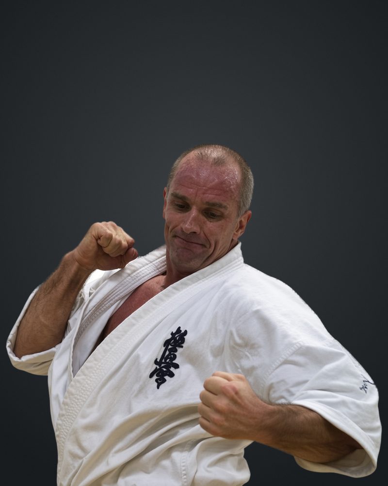 Shihan Judd Reid in his Kyokushin gi, throwing a punch